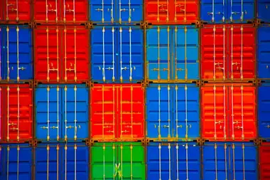 Cargo container being loaded for transportation