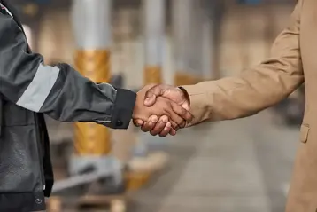Manager and worker concluding a business deal