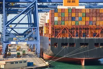Containers on a vessel at a global market cargo shipping port
